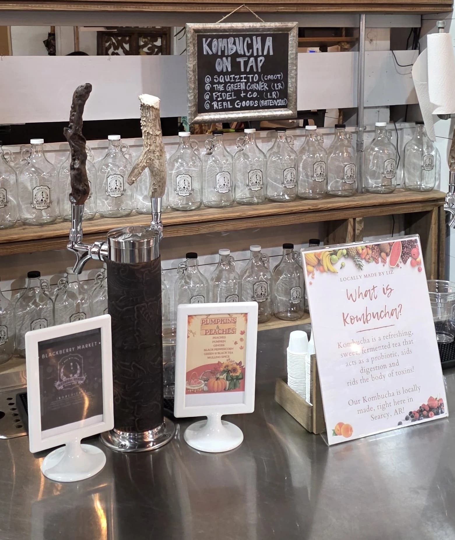 The Natural State Bucha Brew tap station, with the kombucha-on-tap chalkboard listing seasonal flavors
